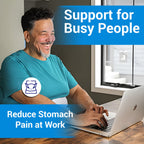Man wearing an abdominal binder for stomach pain relief and lower back support while working at a desk in Australia
