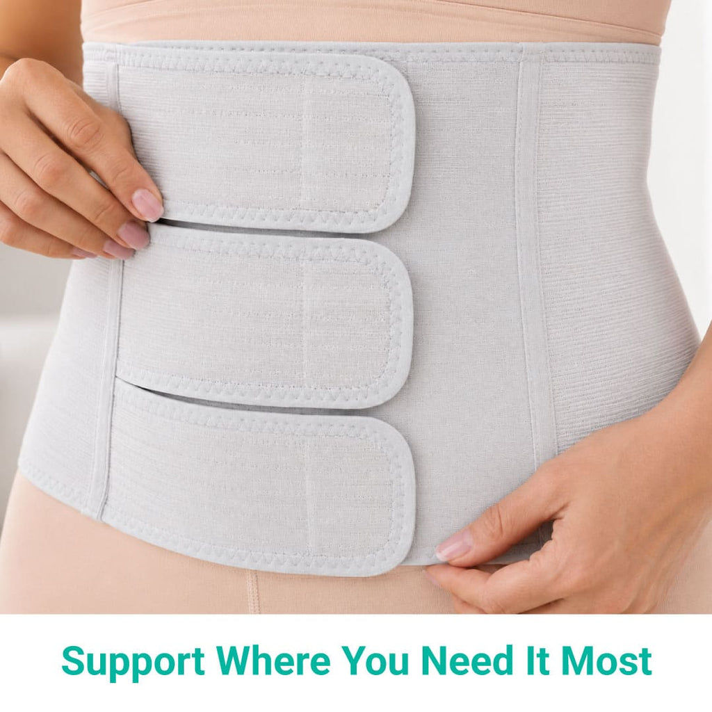 Close-up of a woman's hands securing the middle adjustable strap of the grey SUPEAK postpartum belly band. Text at the bottom reads "Support Where You Need It Most."