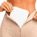 Lipo foam pad positioned under a compression faja for post-surgery abdominal support and comfortable compression